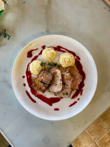 Double-Boned Pork Chop with Garlic Plum-Syrah Sauce